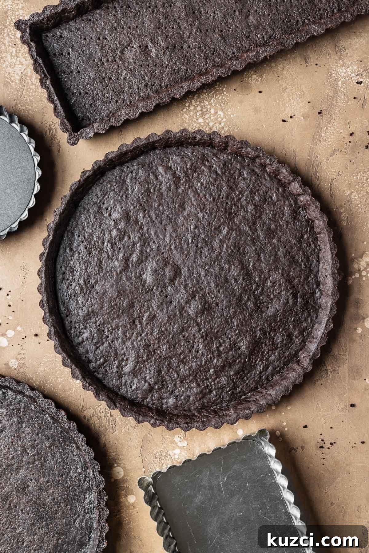 A round baked chocolate tart crust.