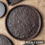 A round baked chocolate tart crust.