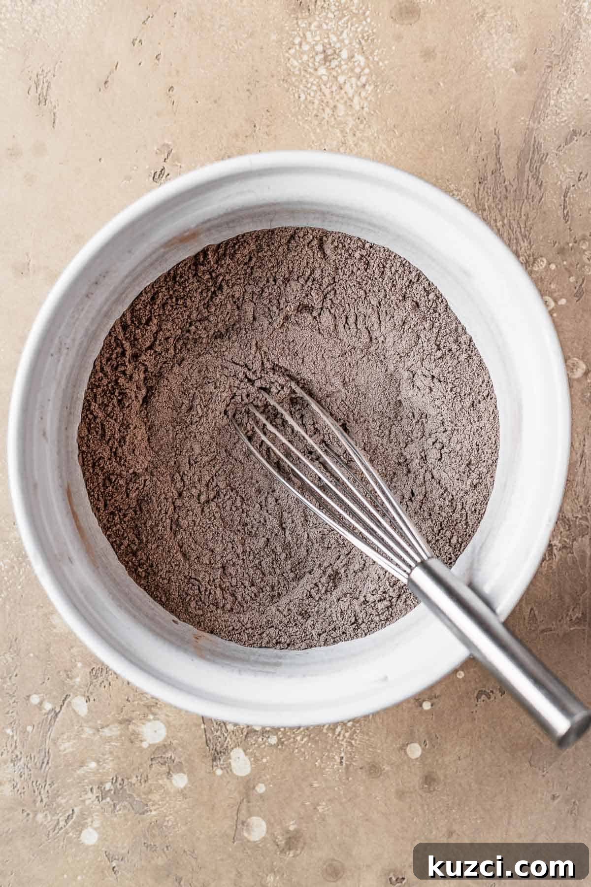Dry ingredients whisked together in a bowl.