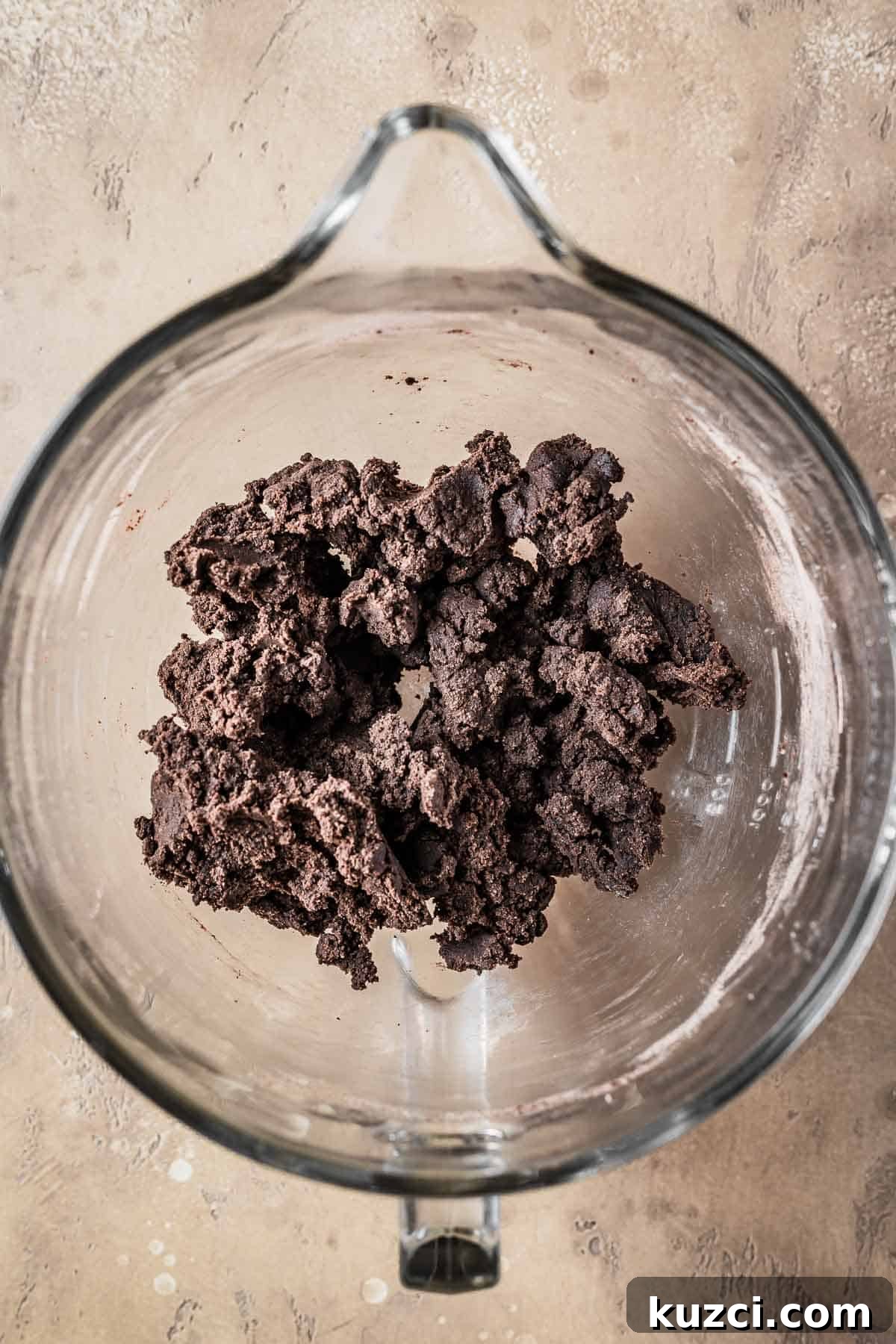 Chocolate tart dough in a mixing bowl.
