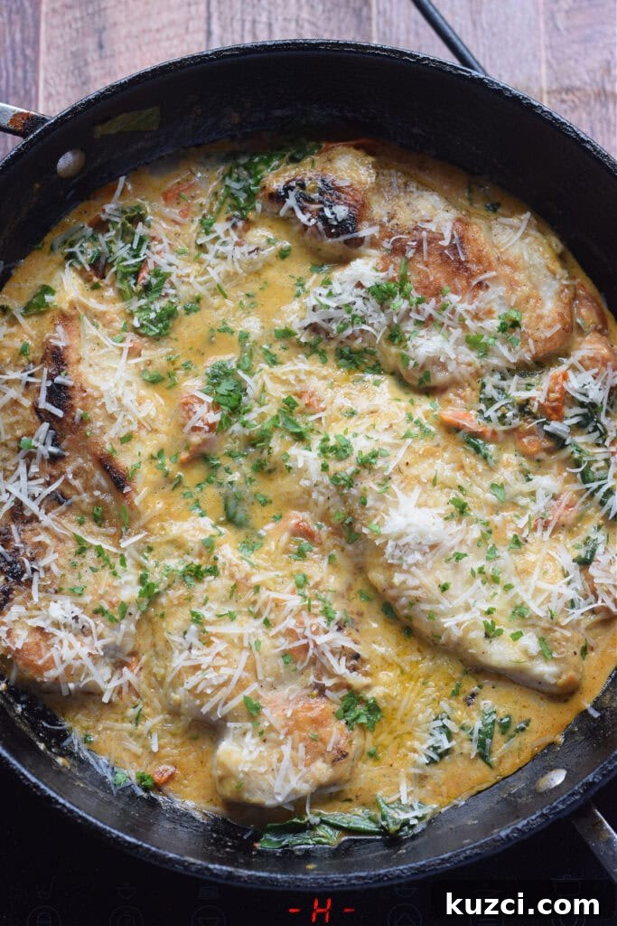 Skillet Chicken with Tomatoes and Spinach Recipe 14 Tomato and spinach chicken in a skillet.