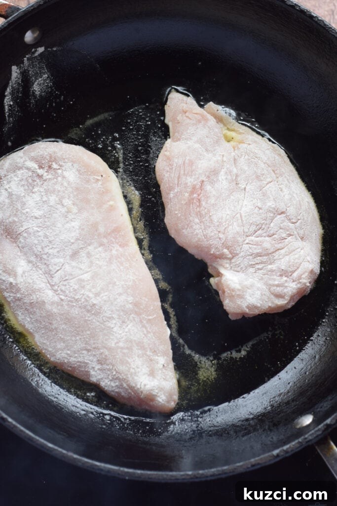 Skillet Chicken with Tomatoes and Spinach Recipe 7 Cooking chicken in a skillet.