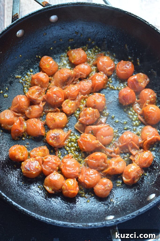 Skillet Chicken with Tomatoes and Spinach Recipe 9 Cooking cherry tomatoes in a skillet.