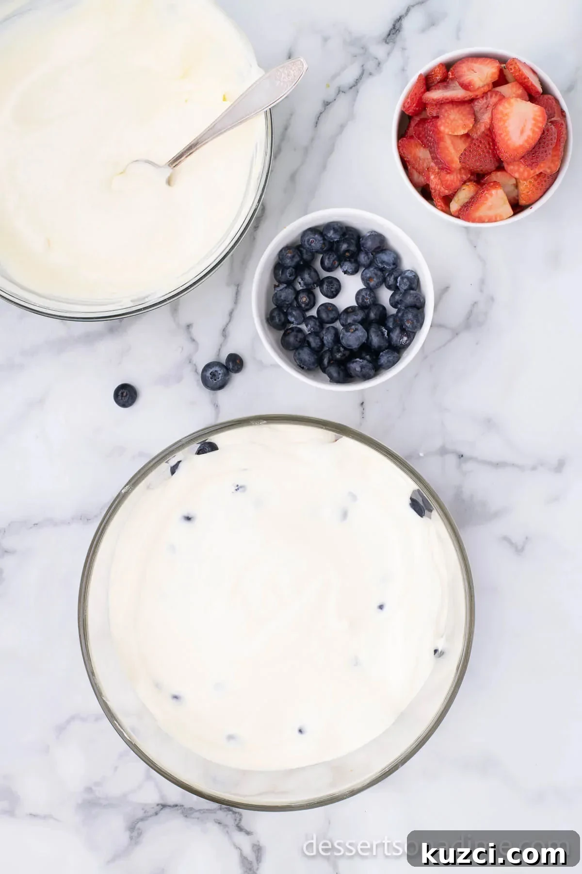 Red White and Blue Trifle Recipe for 4th of July 9 Pudding mixture layered over fruit in a trifle dish