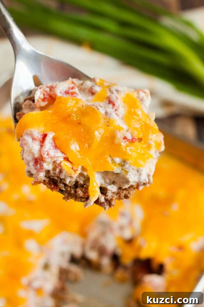 Keto Pepperoni Pizza Stuffed Peppers 7 keto casserole beef and tomato on spoon being served