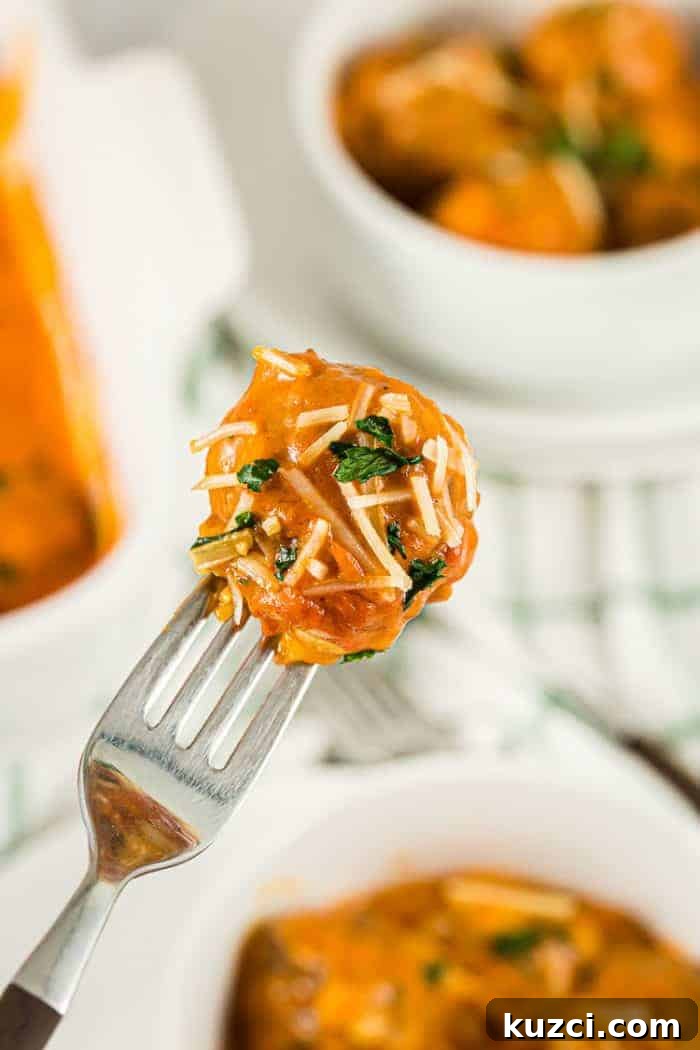 Keto Pepperoni Pizza Stuffed Peppers 8 fork holding up a bite of keto meatball casserole