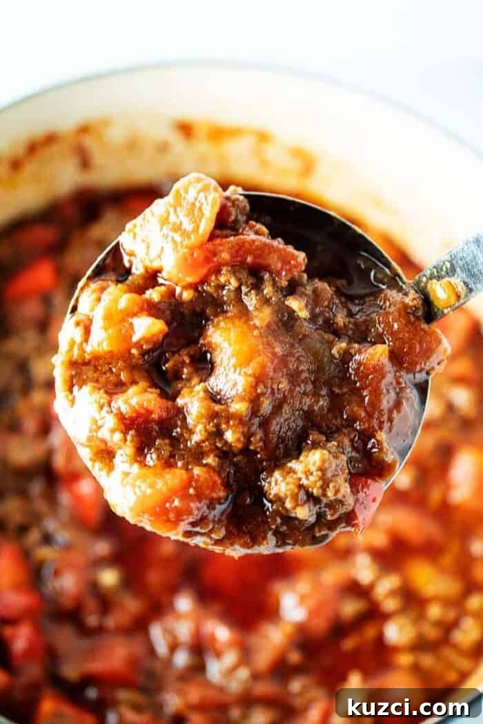 Keto Pepperoni Pizza Stuffed Peppers 9 ladle with big scoop of keto chili over pot