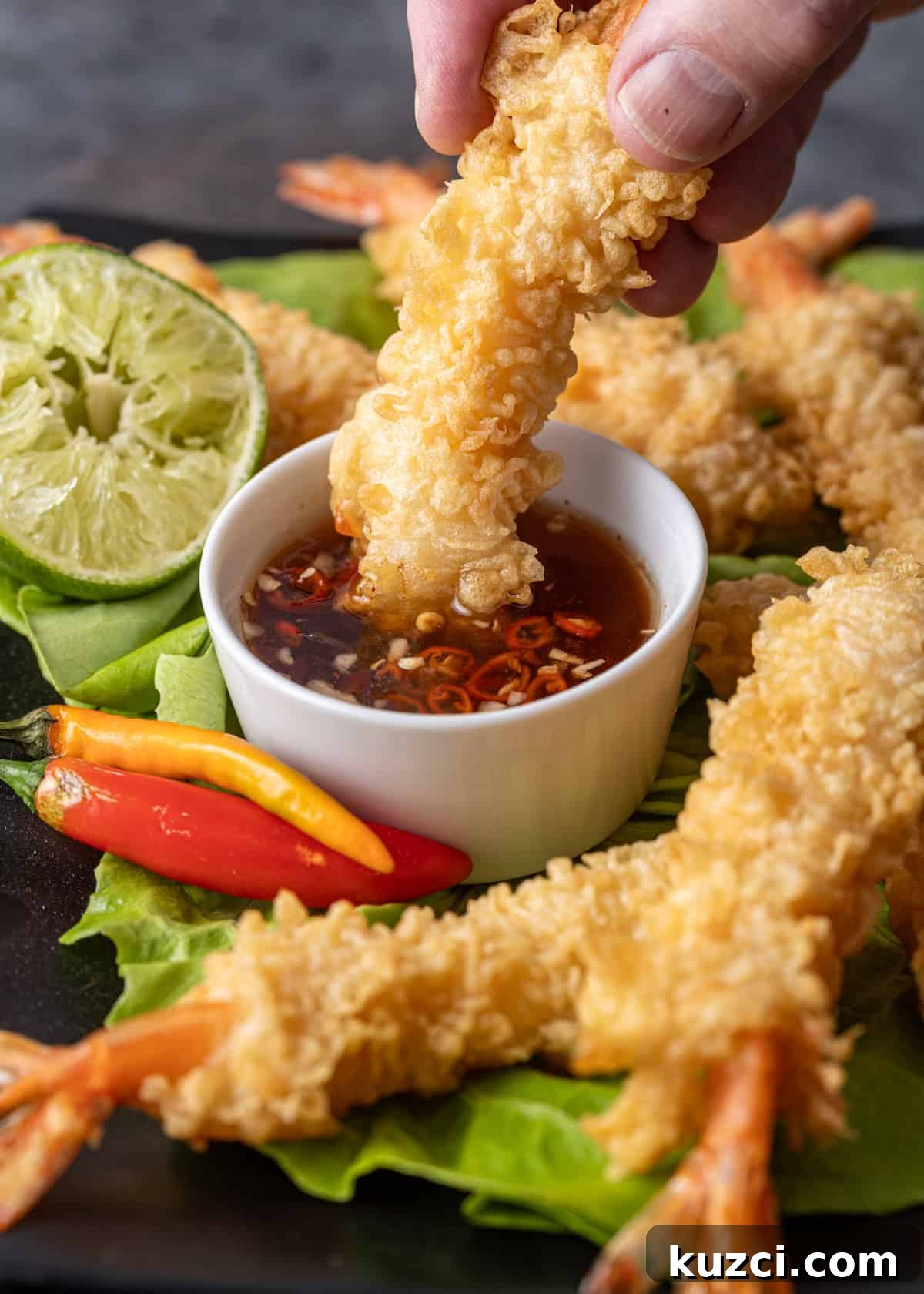 Nuoc Cham Recipe: Authentic Vietnamese Dipping Sauce 11 dipping crispy shrimp in a small white bowl of my nuoc cham recipe