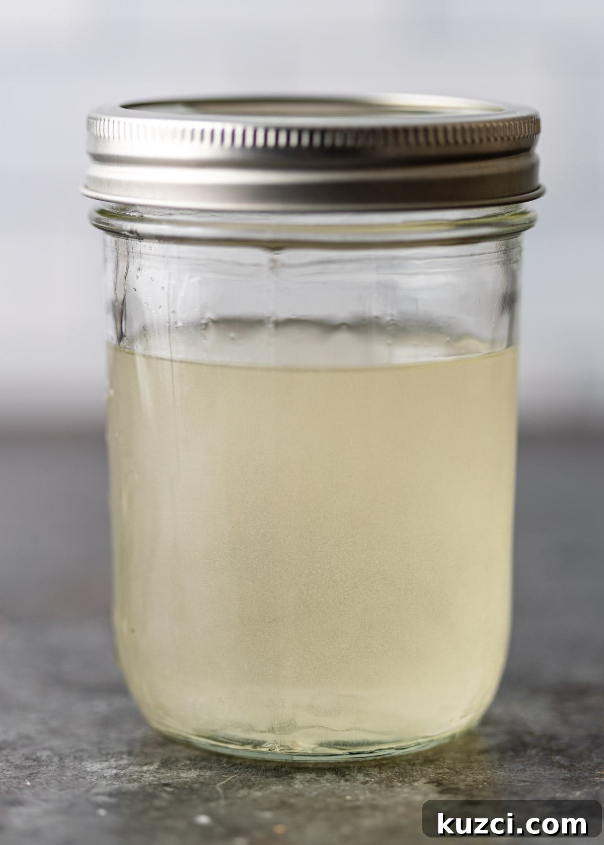 Nuoc Cham Recipe: Authentic Vietnamese Dipping Sauce 6 process shot: sugar shaken in hot water to dissolve