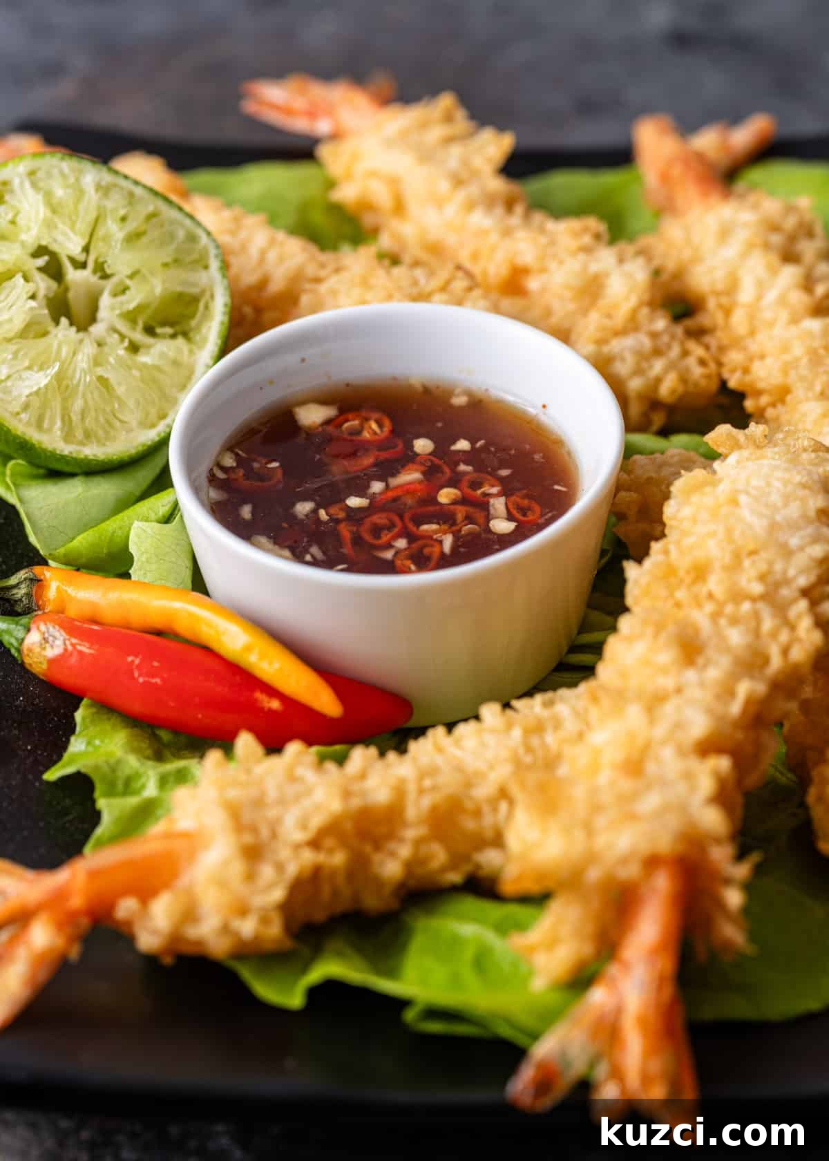 Nuoc Cham Recipe: Authentic Vietnamese Dipping Sauce 10 nuoc cham sauce in a white ramekin with crispy shrimp