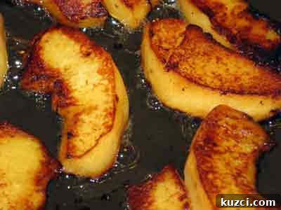 sauteeing quince for greek recipe beef with quince mosxari me kydonia.