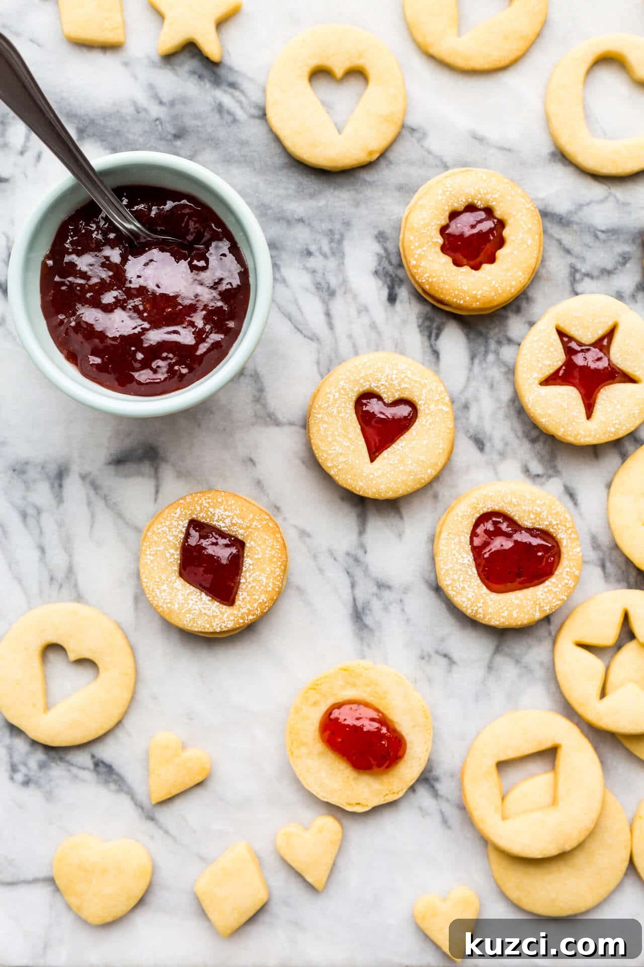 Jam-Filled Shortbread Cookies Recipe 2 Shortbread cutout cookies sandwiched with strawberry jam filling.