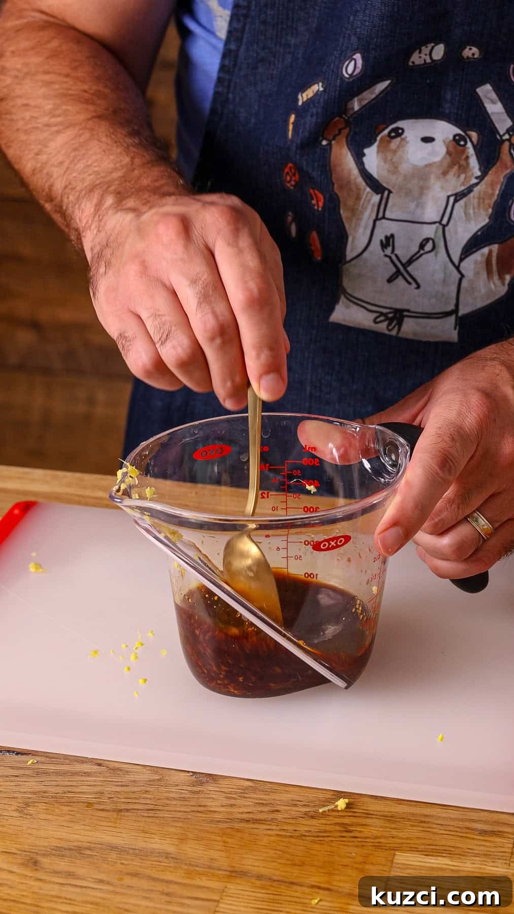 Honey Ginger Glazed Chicken Recipe 4 A ginger honey soy mixture getting stirred in a measuring cup.