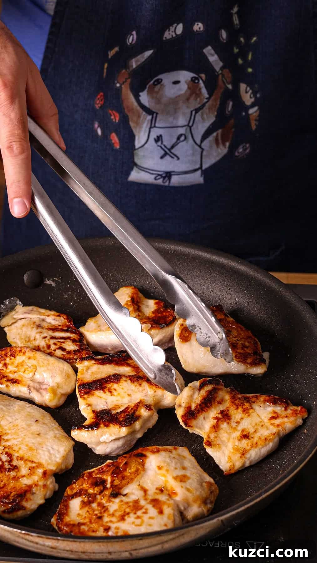 Honey Ginger Glazed Chicken Recipe 7 Sliced chicken breasts getting seared in a nonstick skillet.