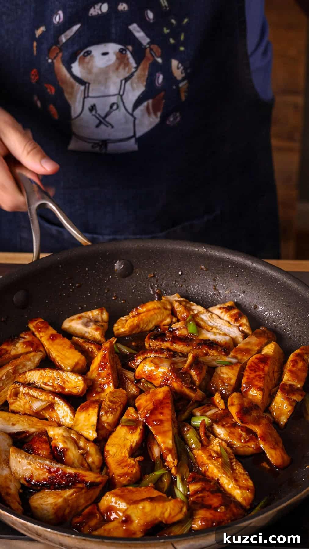 Honey Ginger Glazed Chicken Recipe 9 Sliced cooked chicken breasts getting tossed in a honey ginger sauce in a nonstick skillet.