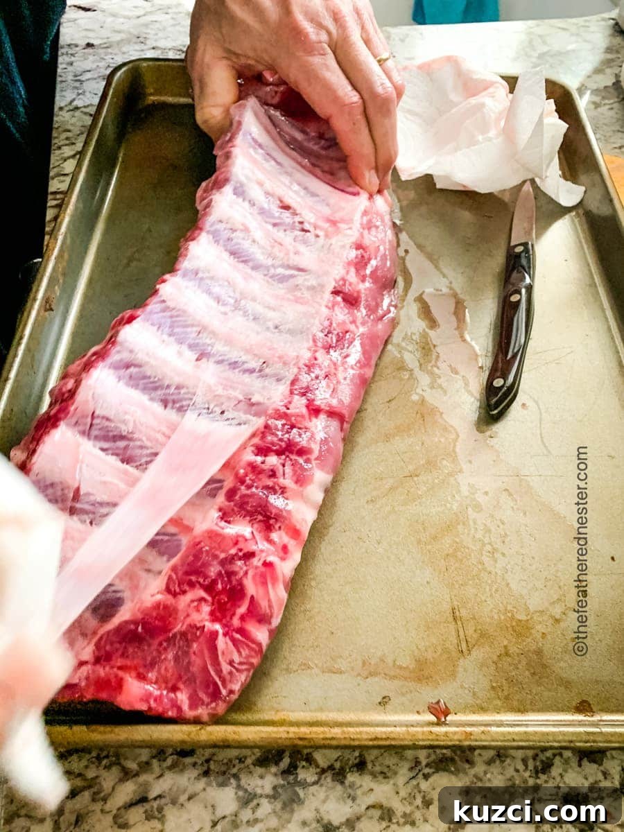 Removing the rib membranes before slow cooking the teriyaki ribs