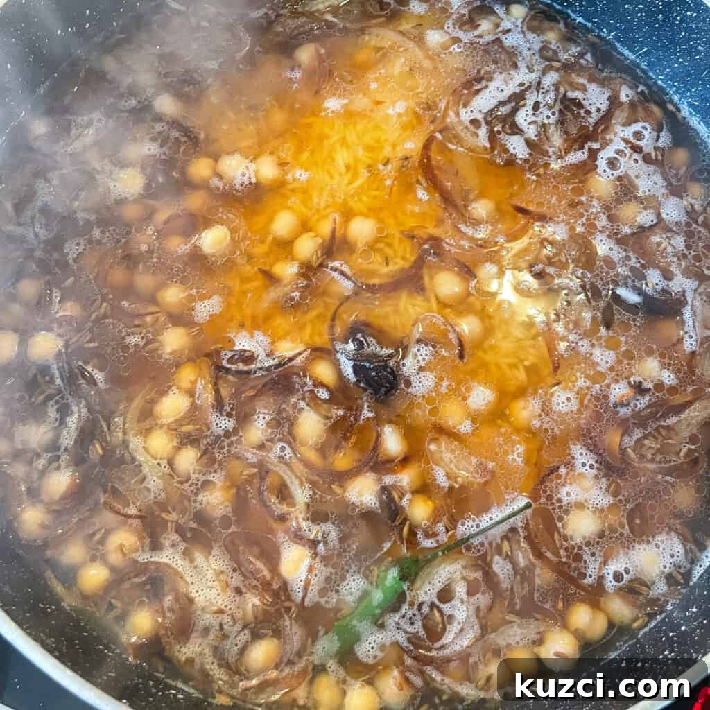 Chana Pulao: Spiced Chickpea Rice Pilaf 5 Adding chickpeas and rice
