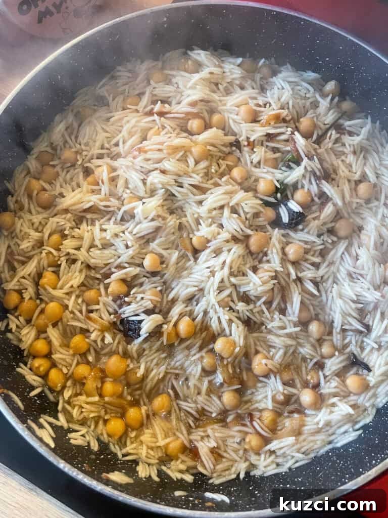 Chana Pulao: Spiced Chickpea Rice Pilaf 6 Pulao after initial cooking