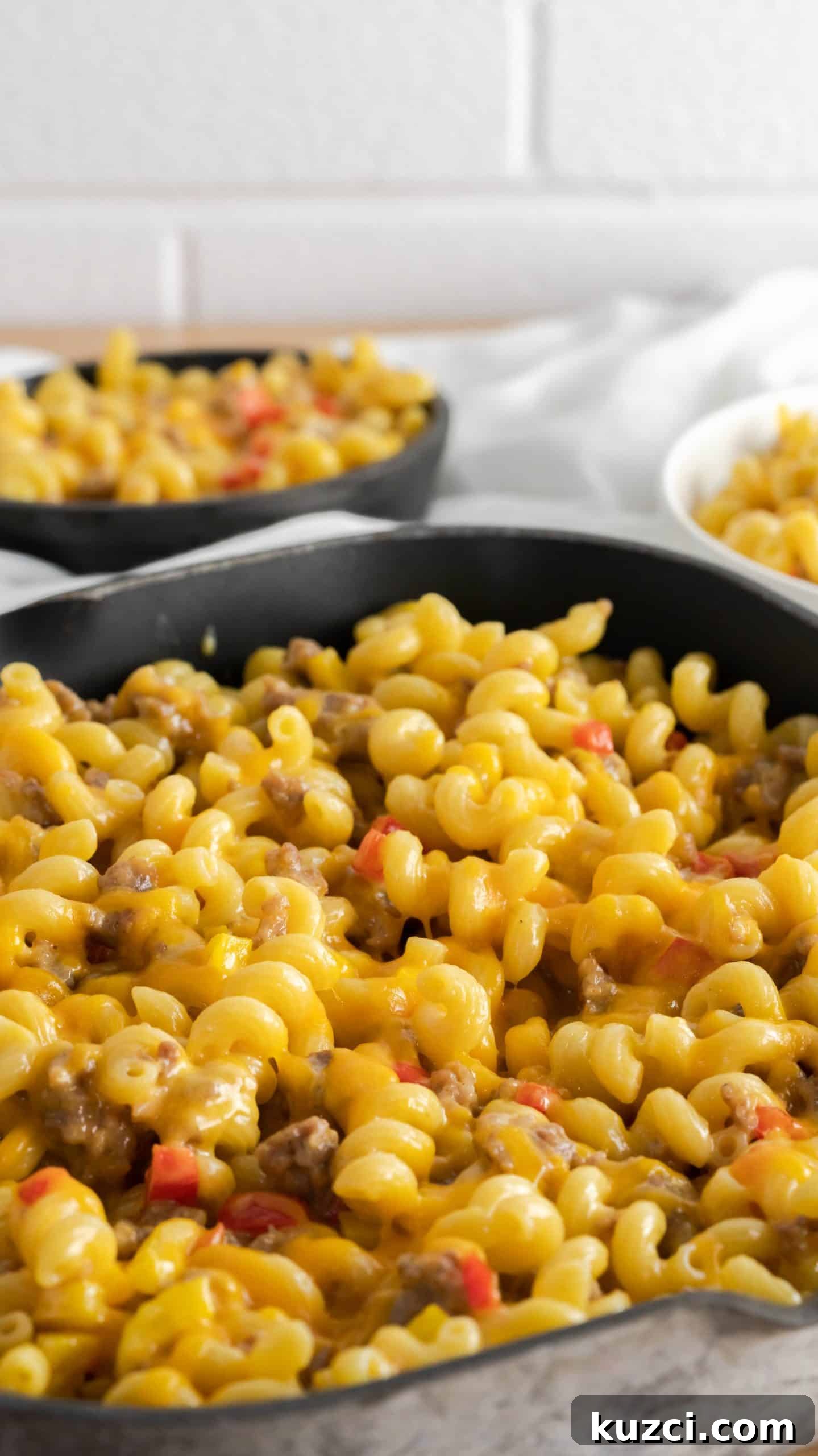Sausage and Peppers Mac and Cheese Recipe 5 Skillet sausage and peppers mac and cheese in a square cast iron skillet.