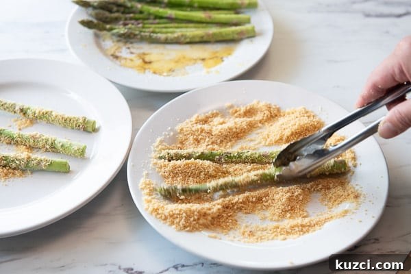 Crispy Air Fryer Asparagus Keto Recipe 6 Coating Asparagus with crushed pork rinds and parmesan
