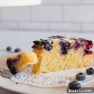 slice of blueberry cake with a bite