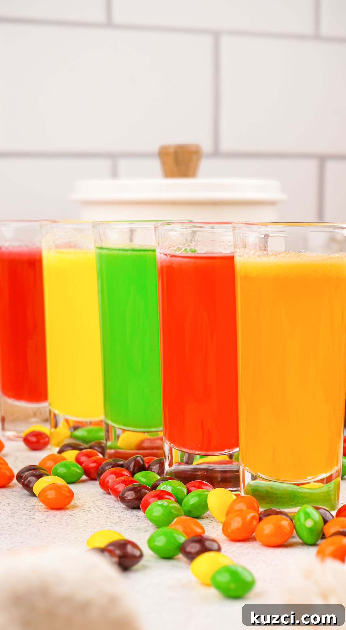 Vodka Cocktail Recipes: Classic and Creative Drinks to Try 7 a row of all 5 colors of Skittles shots in glasses