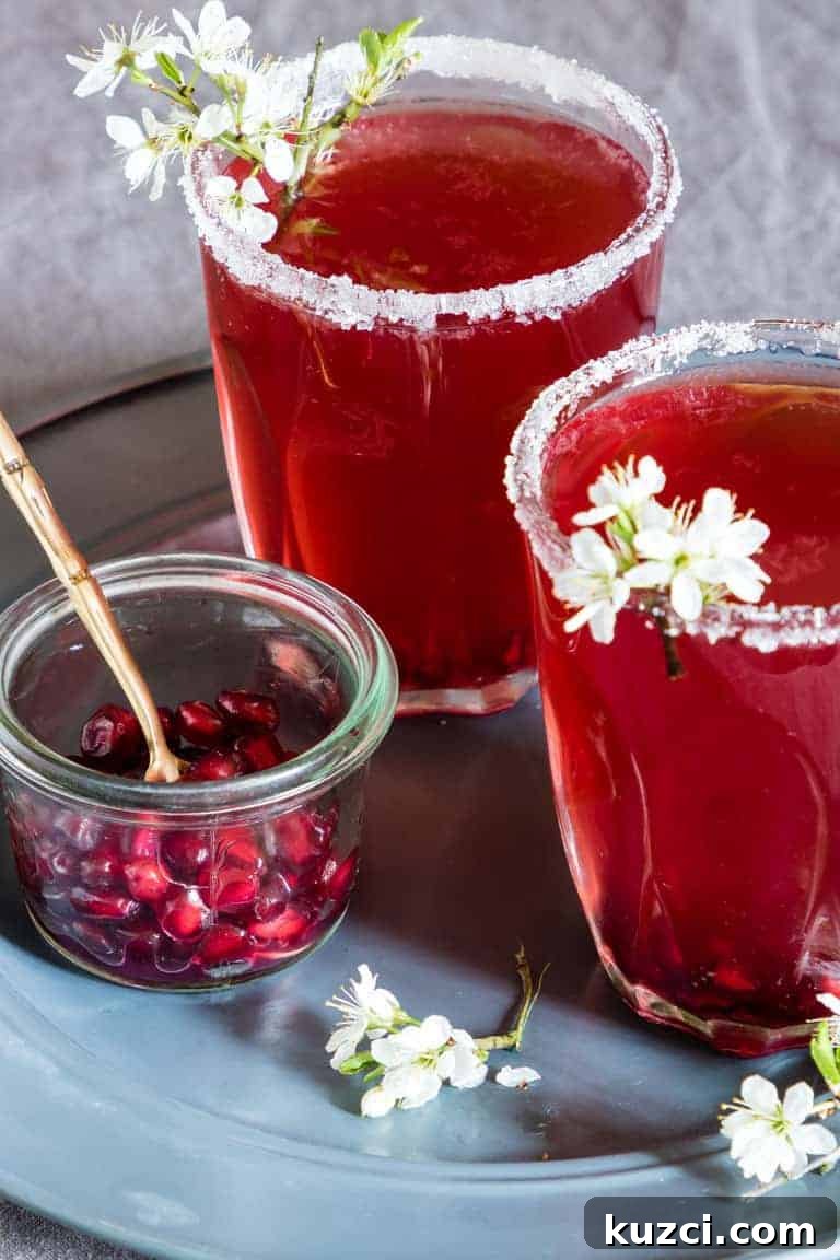Vodka Cocktail Recipes: Classic and Creative Drinks to Try 10 2 glasses of Pomegranate Martini with pomegrante seeds