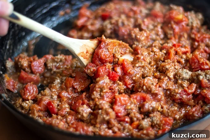 A picture of cooking the meat sauce in a skillet