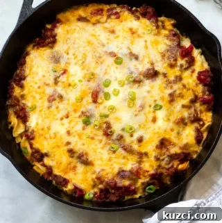 Ground beef egg noodle casserole topped with melted cheeses