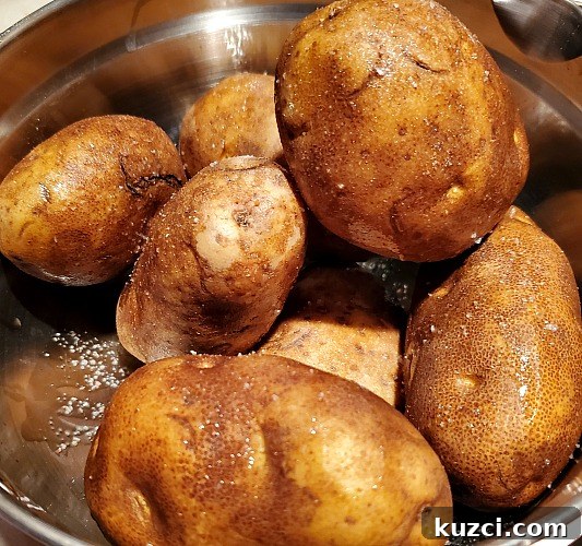 Baking potatoes Rubbed with olive Oil And garlic salt before smoking