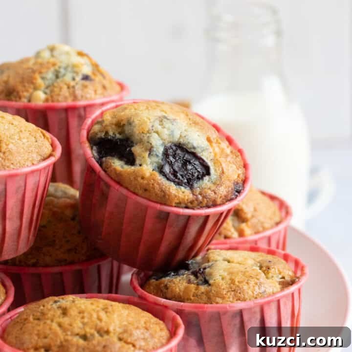 Cherry muffins on a cake stand.
