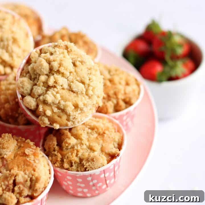 A pile of strawberry muffins on a plate