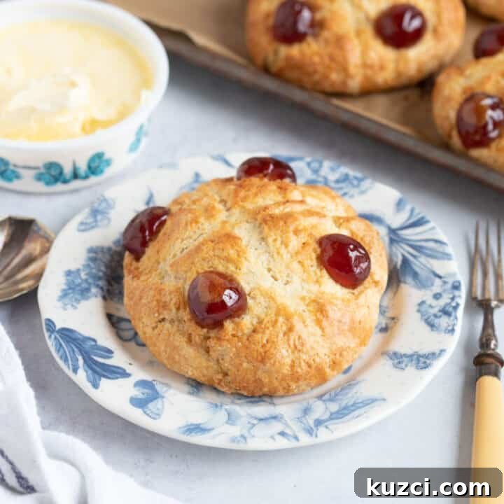 Victoria scone with glace cherries on top.