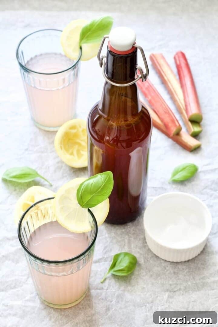 Homemade rhubarb cordial bottle and glass.
