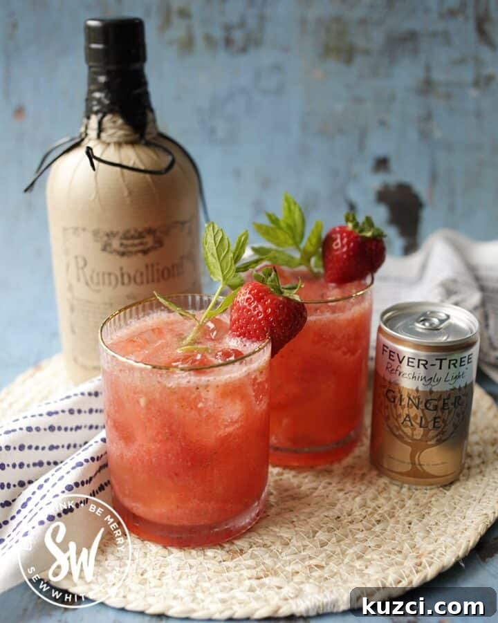 Strawberry rum cocktail in a glass.