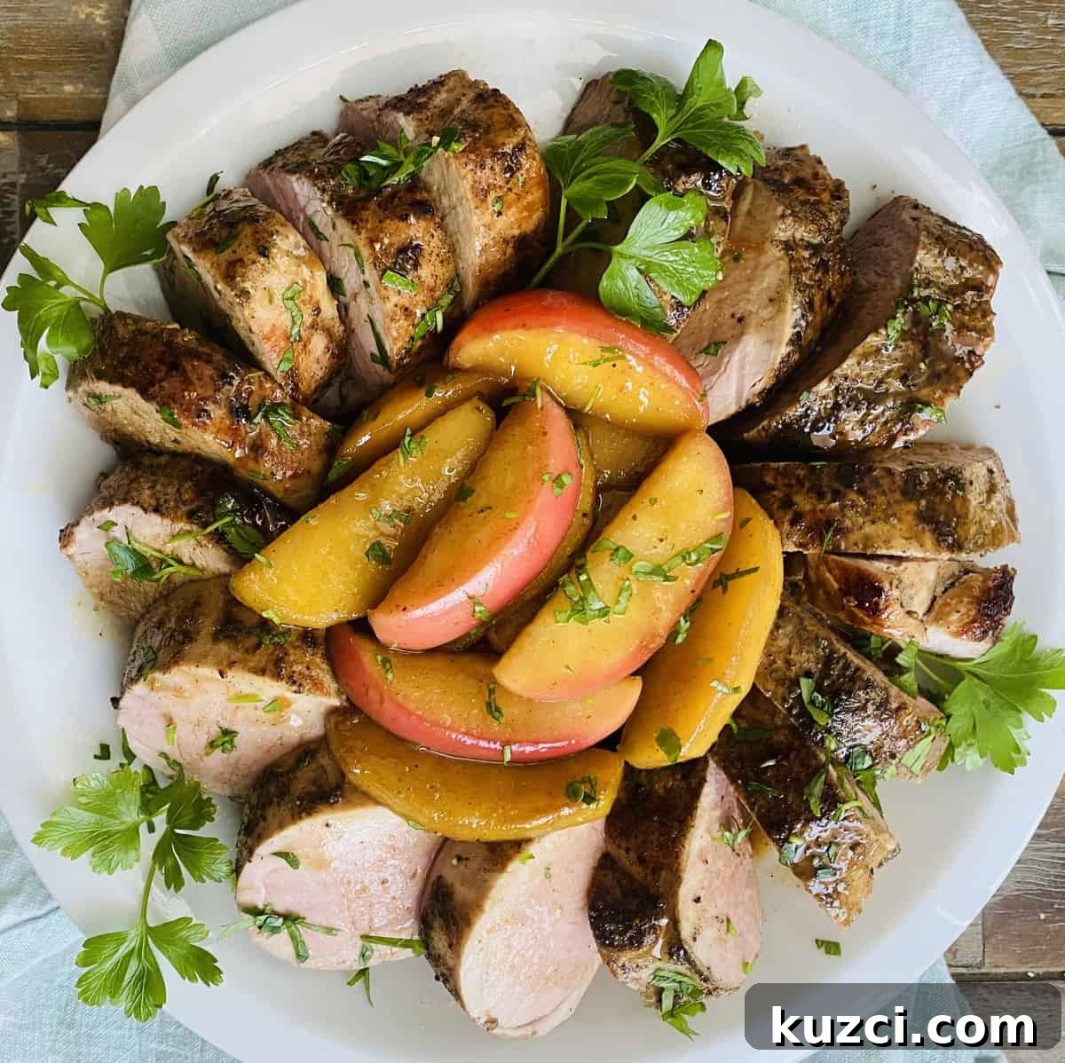 Maple Glazed Pork Tenderloin with Apples 11 Maple glazed pork tenderloin with sautéed apples.