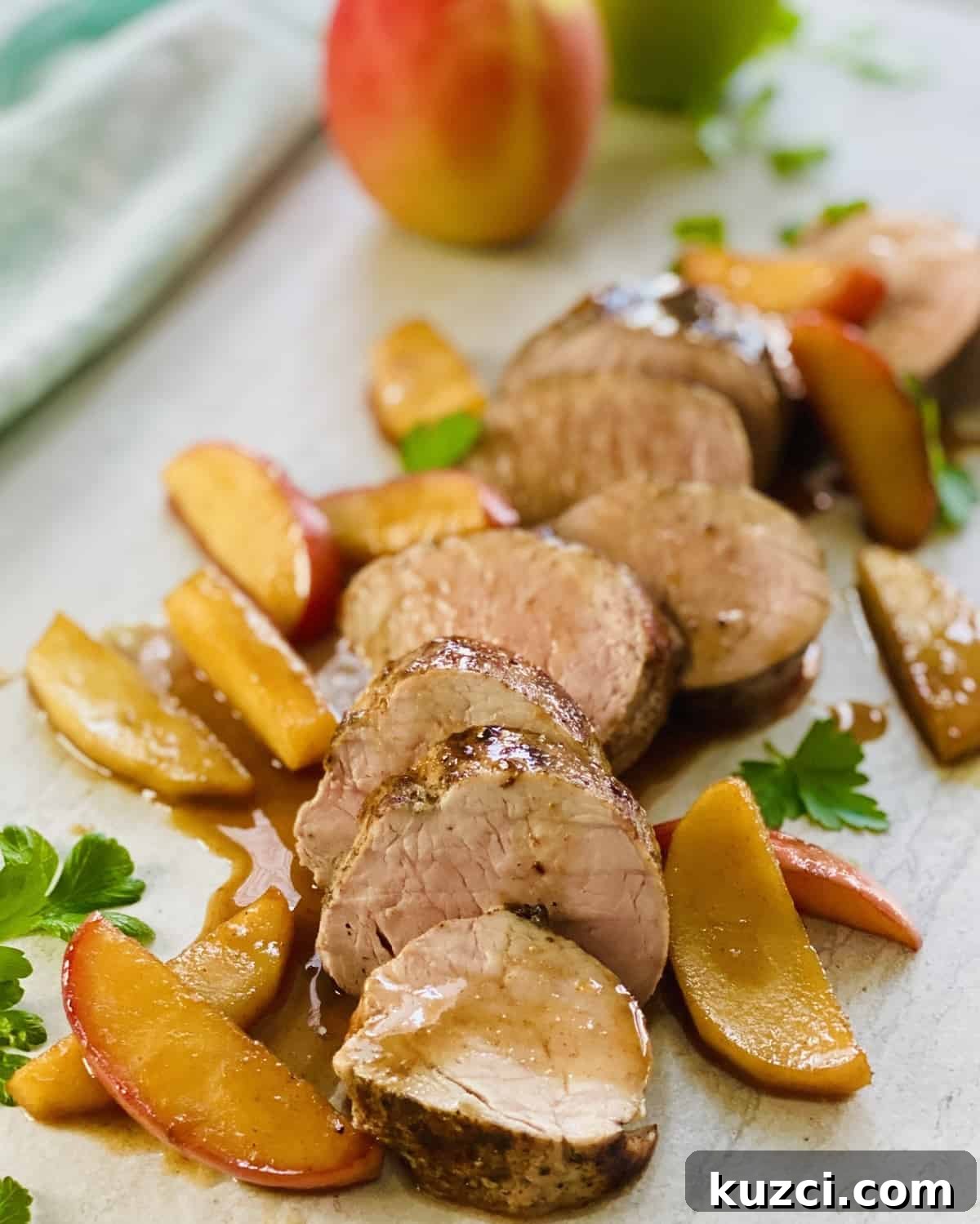 Maple Glazed Pork Tenderloin with Apples 12 Seared and sliced pork tenderloin with sautéed apples.
