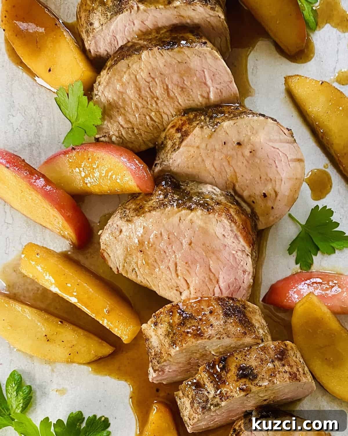 Maple Glazed Pork Tenderloin with Apples 7 Slices of maple glazed pork tenderloin with sautéed apples.