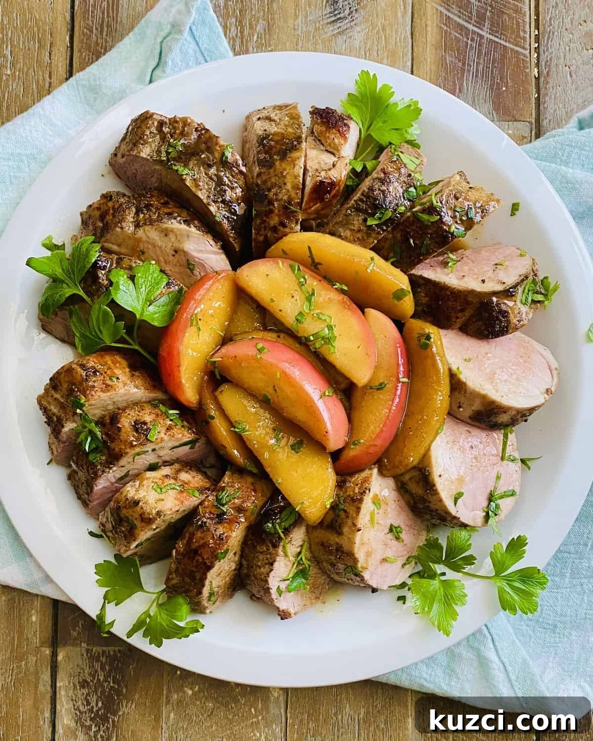 Maple Glazed Pork Tenderloin with Apples 8 A platter of roasted pork with apples.