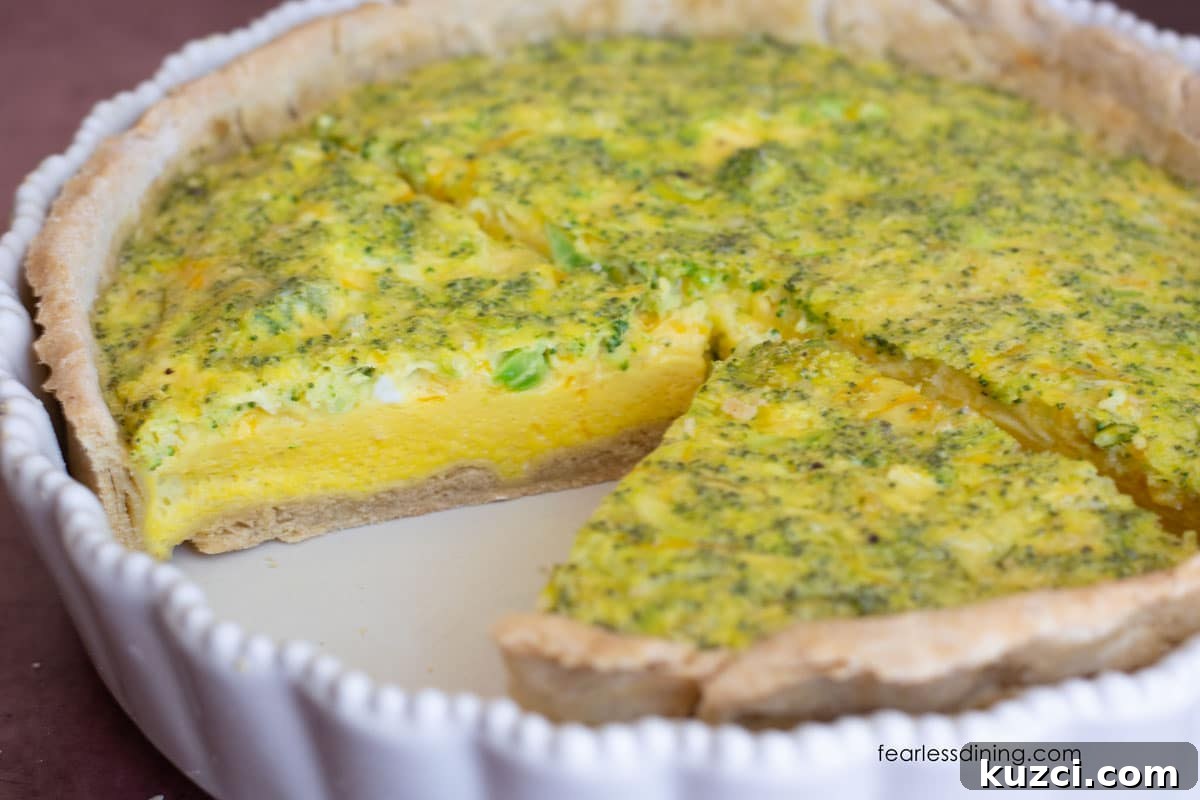 Gluten-Free Cheddar and Broccoli Quiche 5 A whole quiche sliced so you can see the inside.