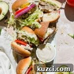 Simple Ground Turkey Recipes That Taste Delicious 20 platter of finished turkey burgers on stone background.