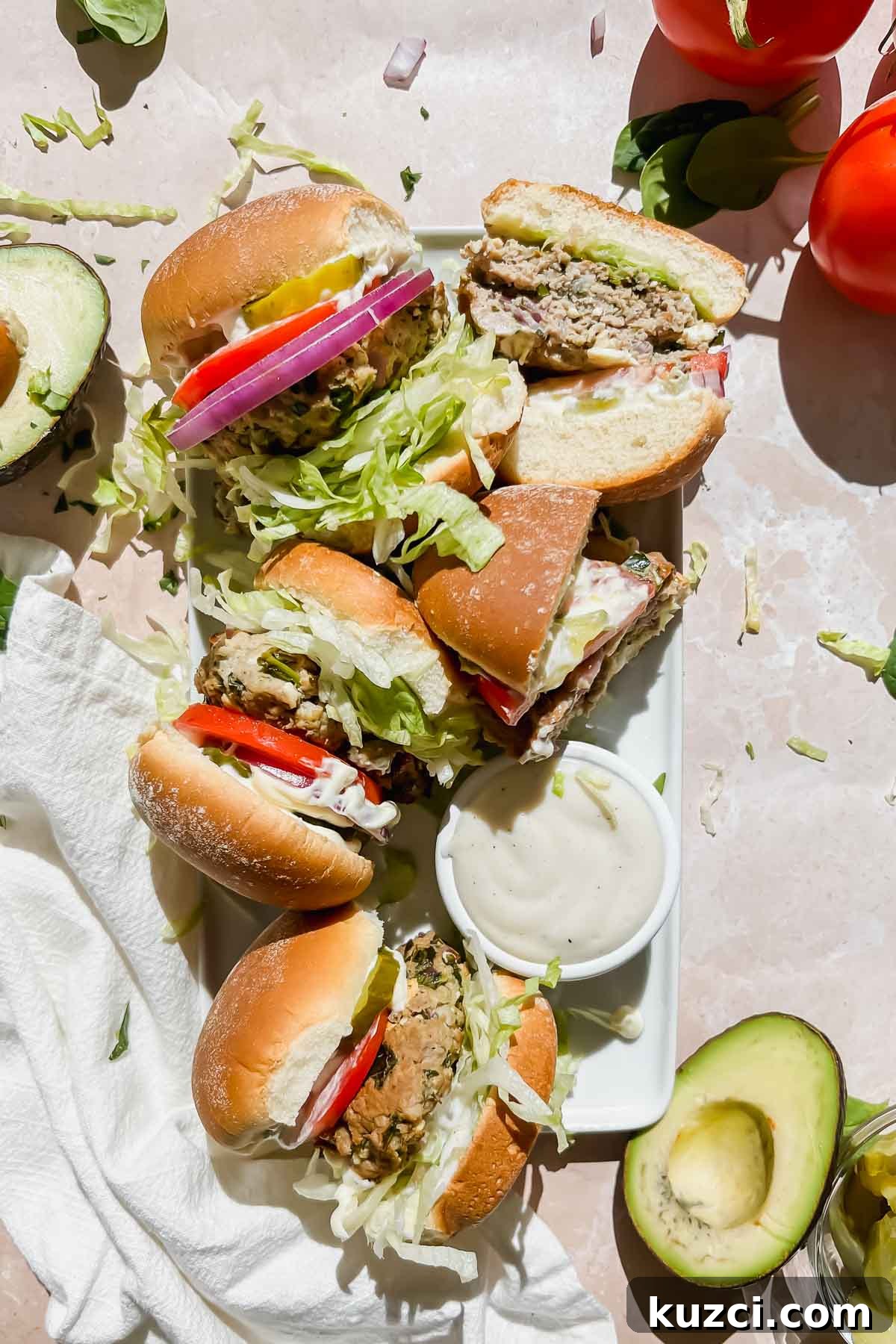 Simple Ground Turkey Recipes That Taste Delicious 21 platter of finished turkey burgers on stone background.