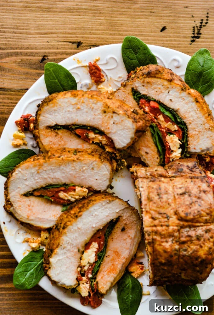 Stuffed Pork Roast with Roasted Red Peppers Feta and Spinach 2 Slices of pork roast stuffed with roasted red peppers, spinach, and feta cheese.