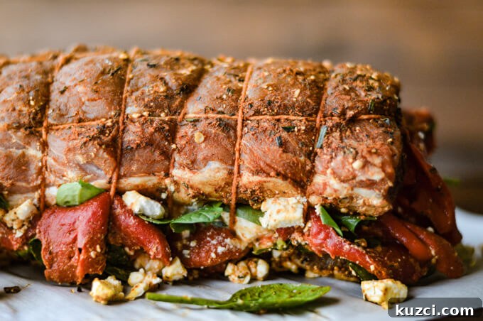 Stuffed Pork Roast with Roasted Red Peppers Feta and Spinach 5 A tied rolled pork roast stuffed with spinach, roasted red peppers, and feta cheese.