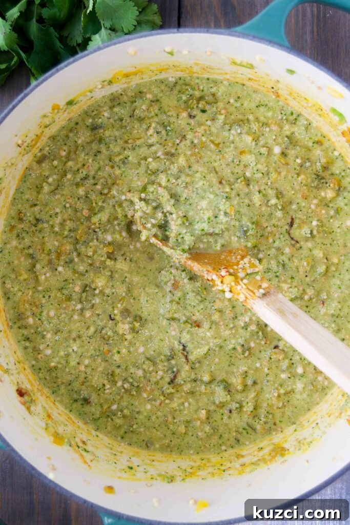 Caruru: Brazilian Shrimp and Okra Stew Recipe 6 Caruru in a dutch oven with a wooden spoon