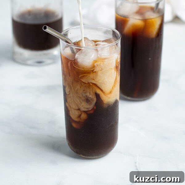 Protein-Packed Breakfast Cookies for Busy Mornings 10 milk being poured into a glass of cold brew coffee