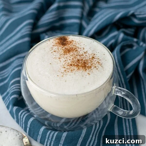 Protein-Packed Breakfast Cookies for Busy Mornings 12 milk steamer drink in a clear mug with cinnamon sprinkled on top