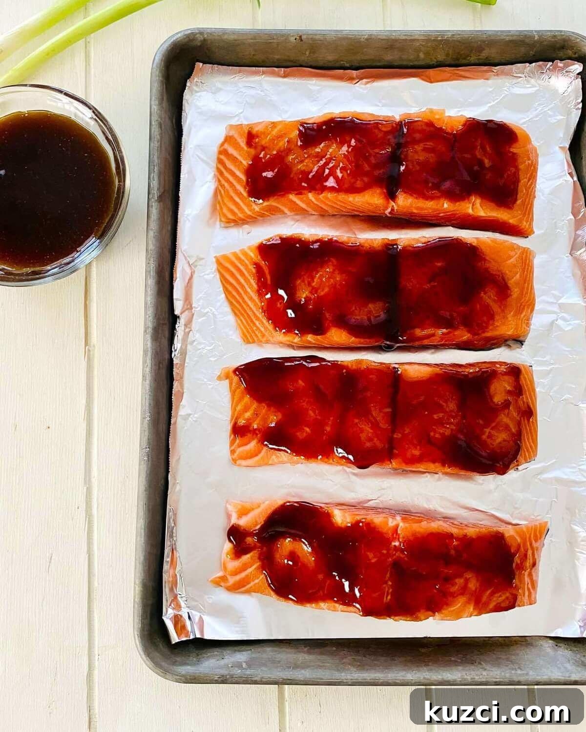 Oven-Baked Teriyaki Salmon with Hoisin, No Marinating 5 salmon brushed with hoisin sauce.