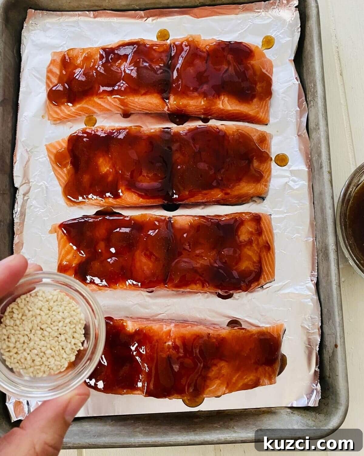 Oven-Baked Teriyaki Salmon with Hoisin, No Marinating 9 salmon topped with hoisin and teriyaki sauces.