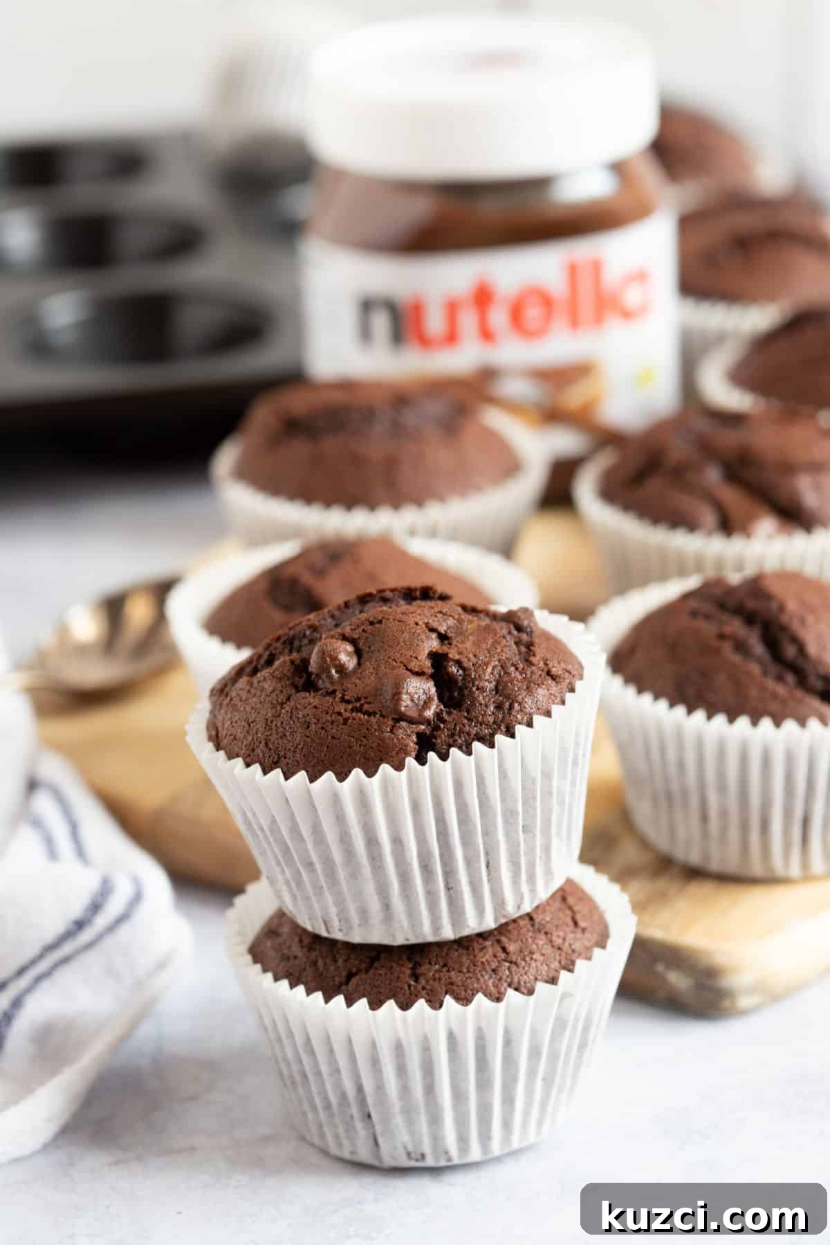 Nutella Chocolate Muffins Recipe 2 A stack of Nutella muffins.
